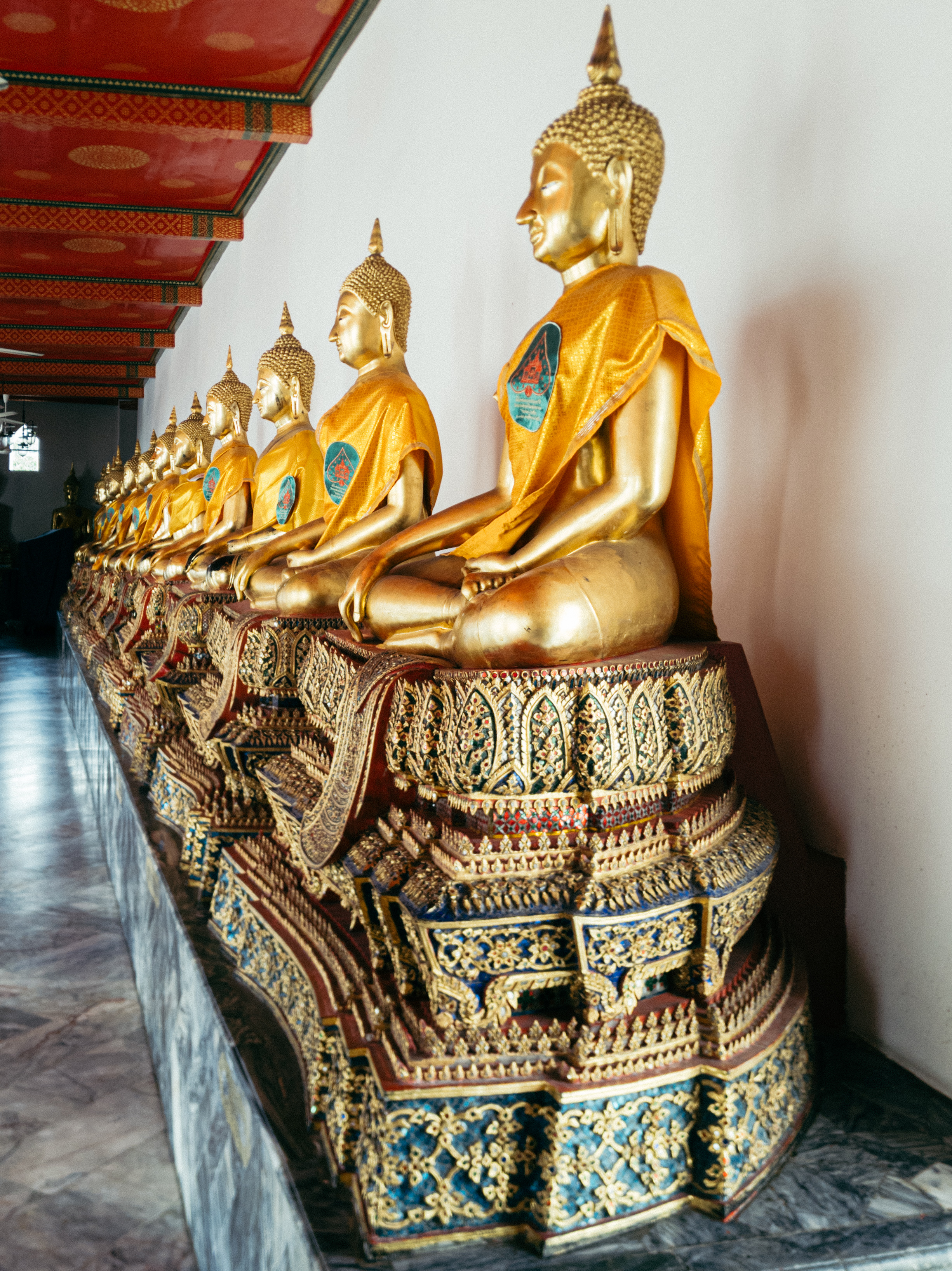 Row of Buddha statues in Thailand