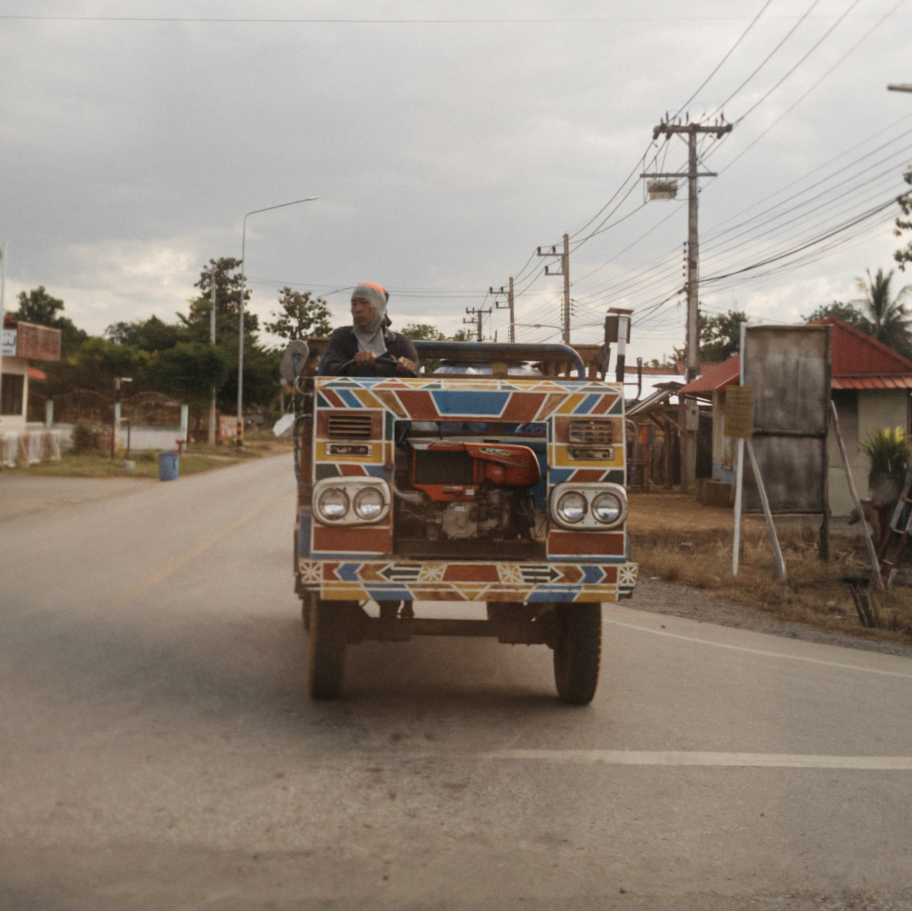 Thai Rice Farmer in his Tractor