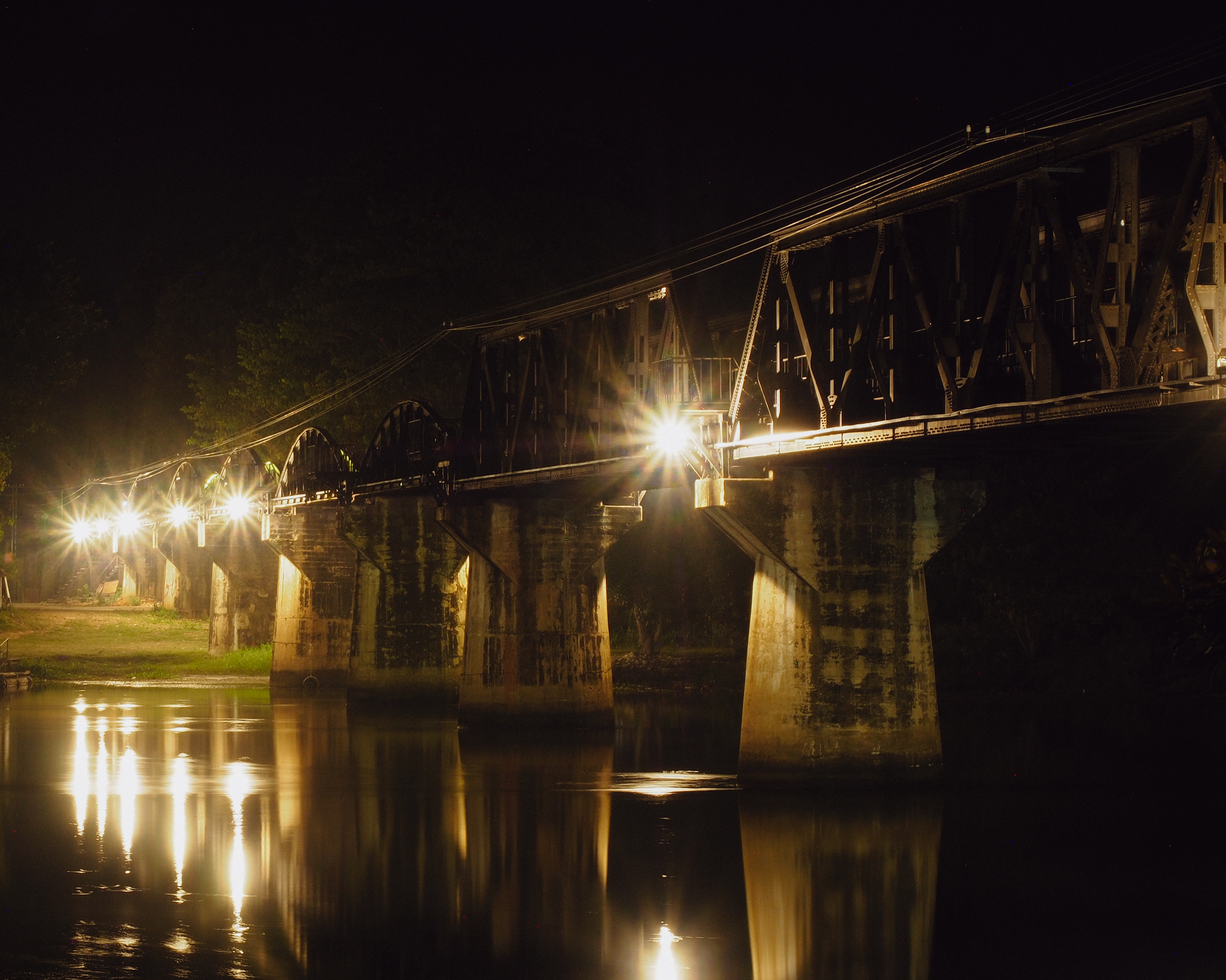 Bridge over the River Kwai illuminated at night