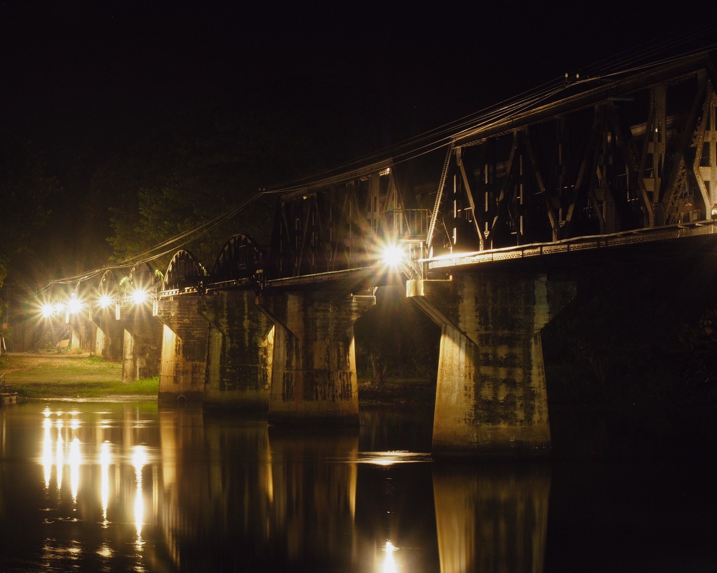 Bridge over the River Kwai illuminated at night