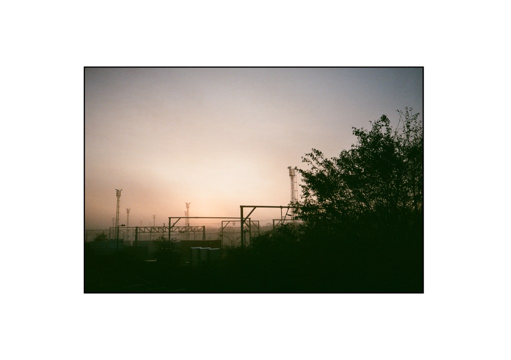 The skyline of lights and cables near the local rail station