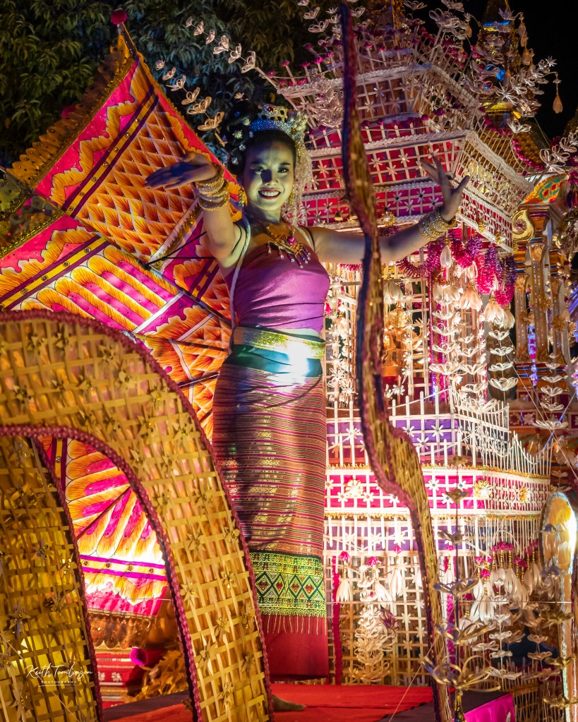 A young Thai lady dances on a Loy Krathong float in 2019