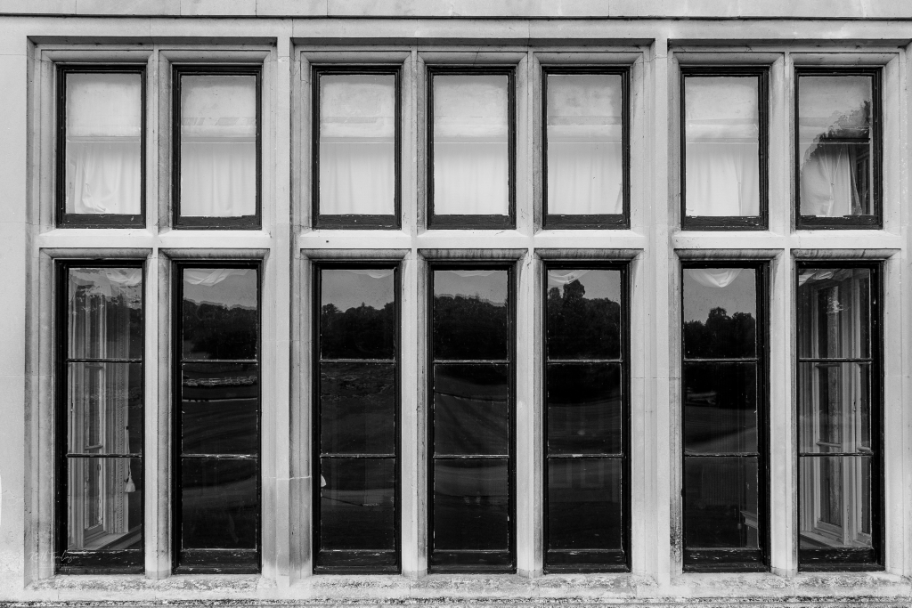 A black and white photo of old Elizabethan windows